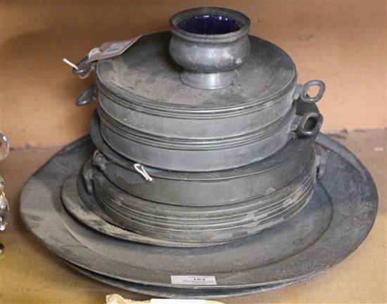 Two antique pewter chargers (one a.f), three pewter plates & four pewter hot dishes (one cover)